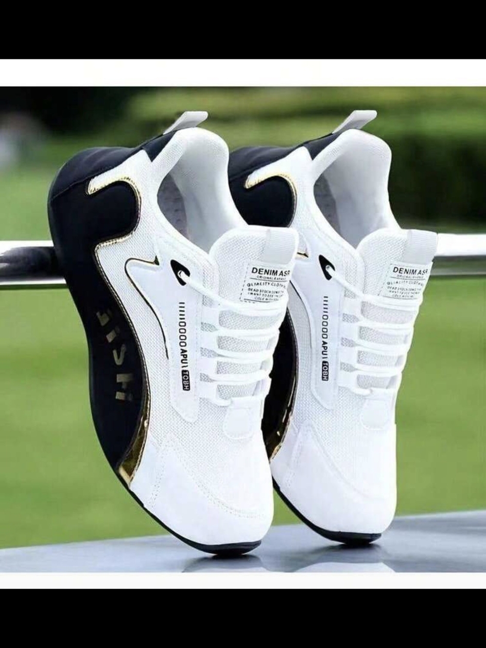 White and Black Men's Sneakers with Gold Accent.